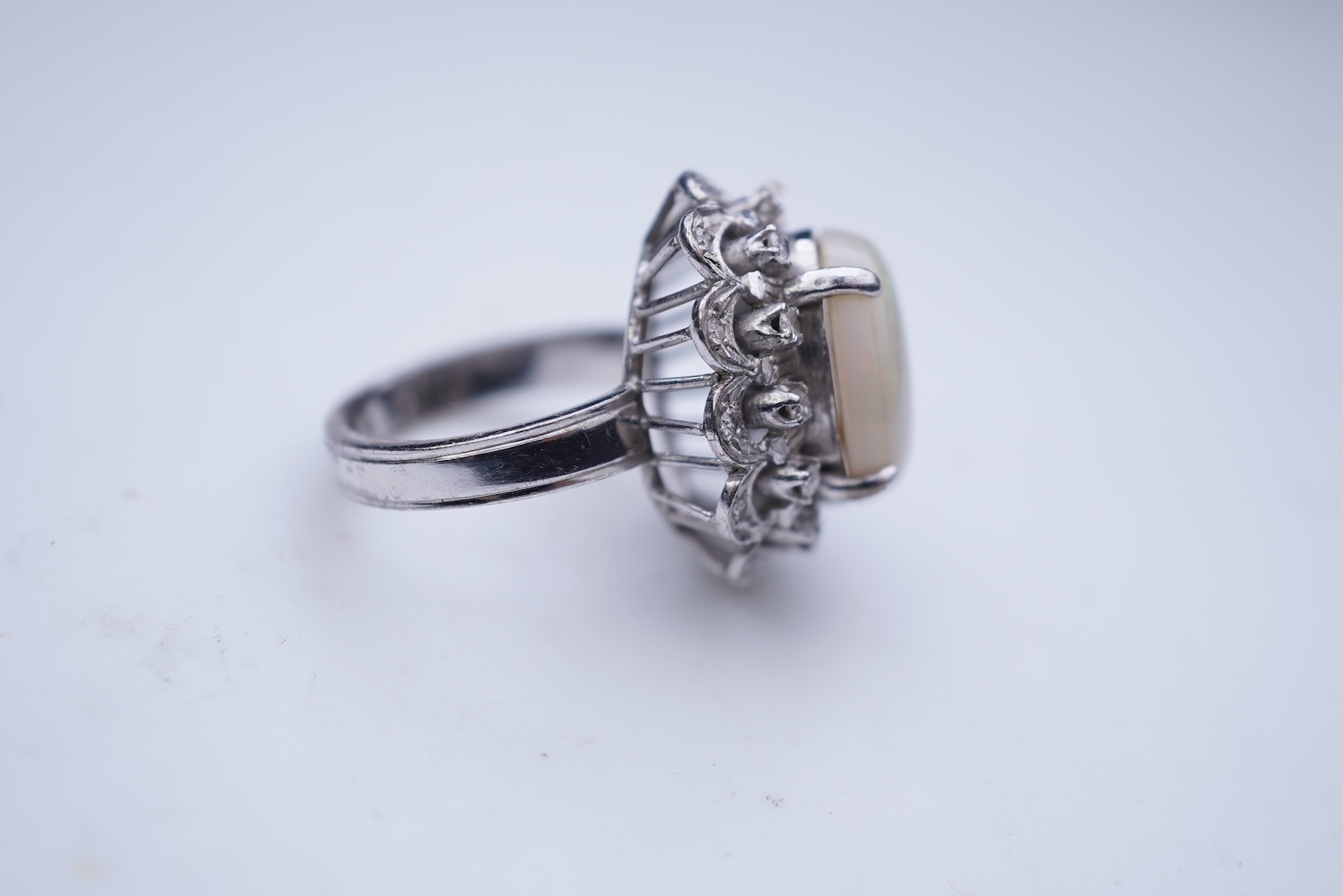 An opal and diamond cluster ring